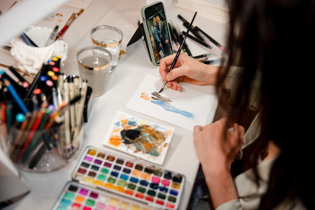 Wedding vendor painting watercolor portraits