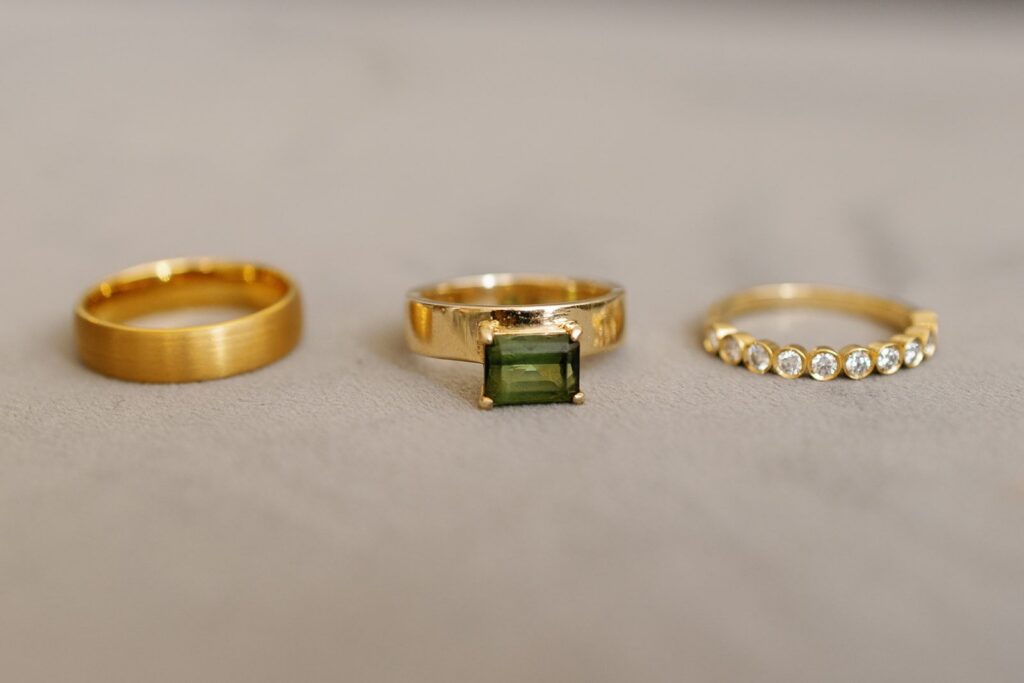 Engagement ring and wedding bands in a line