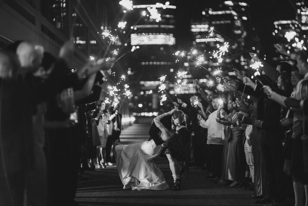 Wedding grand exit groom kissing bride