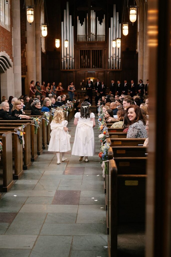 Flower girls walking down the aisle