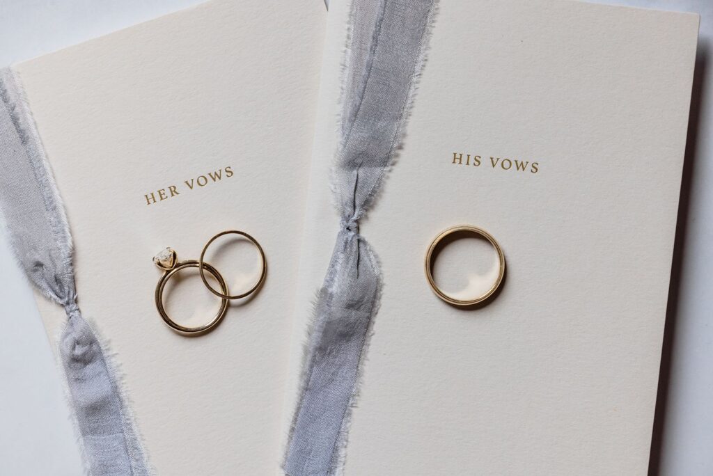 His and hers vow books with wedding rings