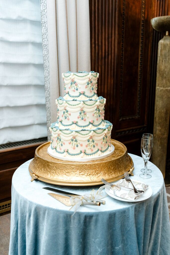 Elaborate wedding cake on blue table