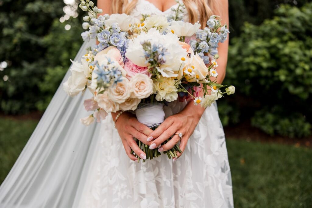 Bride holding floral bouquet