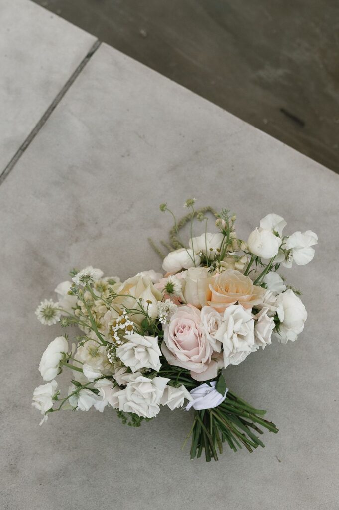 Flower bouquet sitting on the sidewalk
