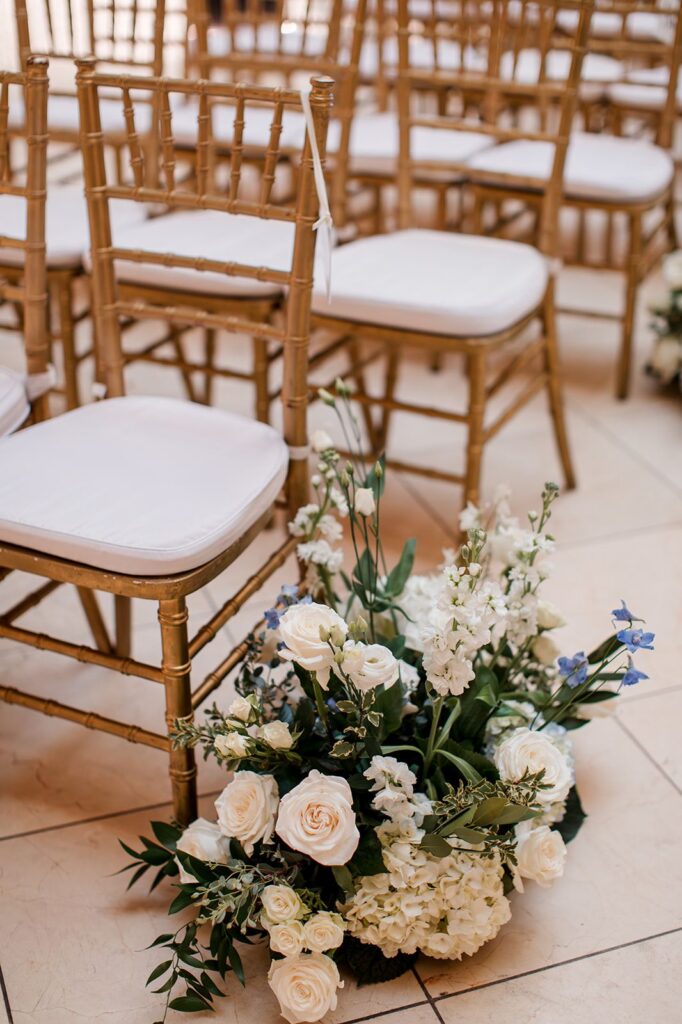 Wedding ceremony chairs and flowers