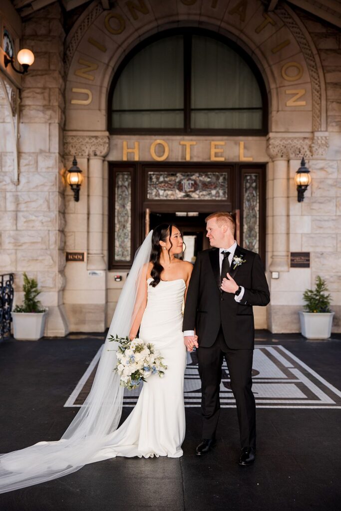 Bride and groom in front of Union Station Hotel in Nashville, TN